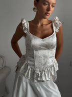 Floral women's top with corset and ruffle details for stylish wear