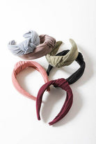 Five stylish topknot headbands for women in various colors for versatile hair styling