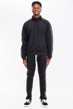 Men's black track pants by Lime Milo, lightweight for active wear