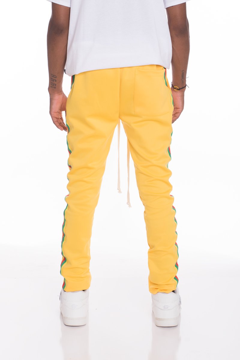 Lime Milo yellow track pants with colorful side stripes for casual wear