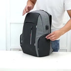 Gray and black travel backpacking backpack with multiple compartments for organization