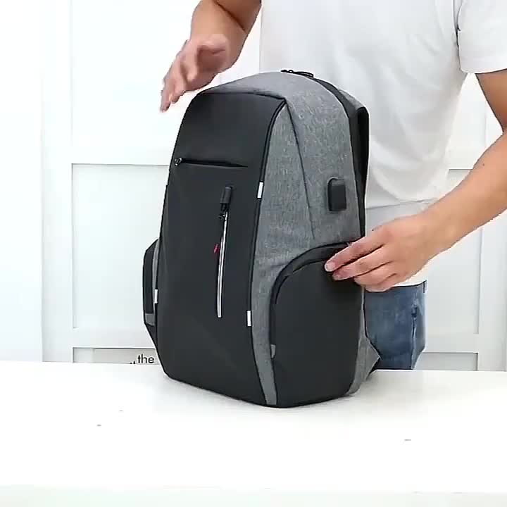 Gray and black travel backpacking backpack with multiple compartments for organization