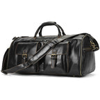 Black leather travel bag with multiple pockets and adjustable strap
