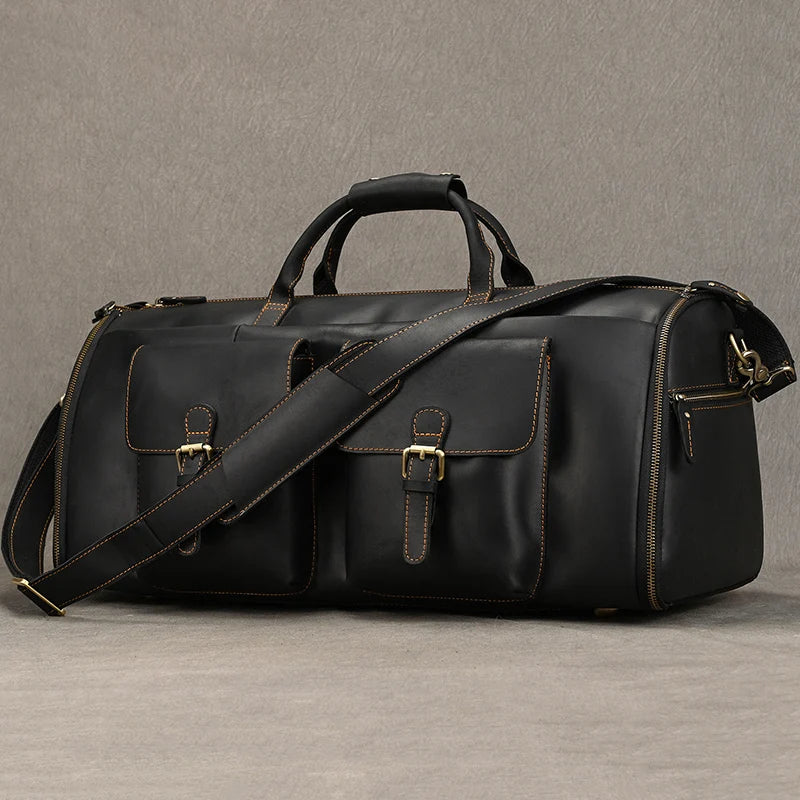 Black leather travel bag with detachable shoulder strap for trips