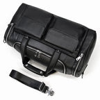 Black leather travel bag with multiple pockets for organized storage