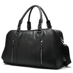 Black leather travel bag with zippered pockets for stylish trips