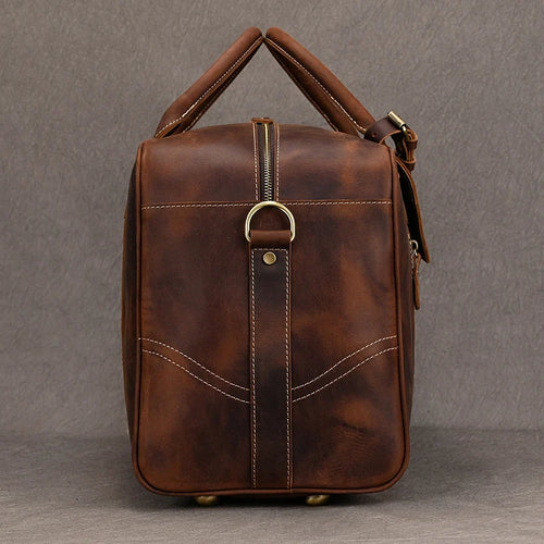 Brown leather travel bag for men, perfect for weekend getaways