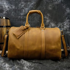 Brown leather travel bag, ideal for weekend getaways and travel