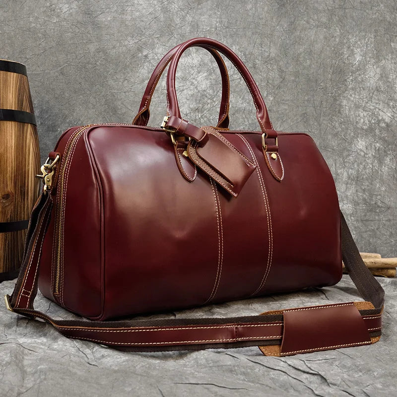 Burgundy leather travel bag, stylish and durable for weekend getaways