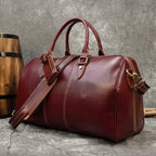 Maroon leather travel bag, perfect for weekend getaways