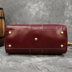 Maroon leather duffel travel bag, great for weekend getaways
