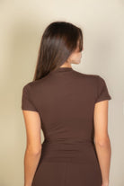 Back view of brown women's T-shirt from VacationGrabs, ideal travel clothing essentials for women