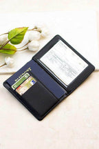 Aili's Corner travel credit card holder in black leather with space for cards and a passport
