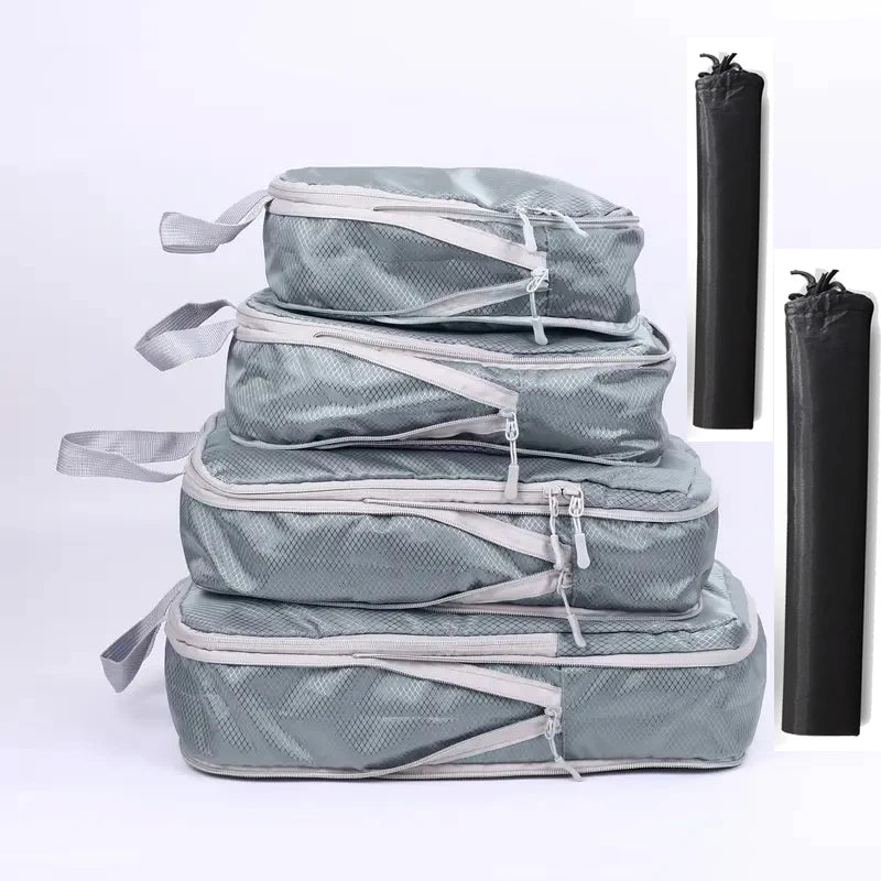 Gray travel packing cubes set for organized luggage transport