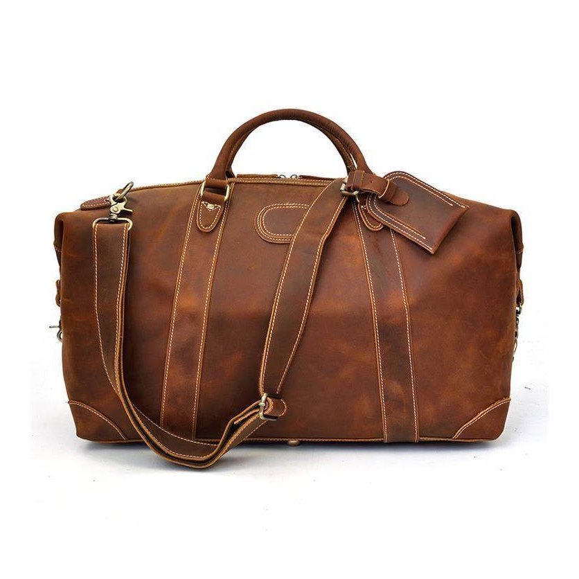 Stylish brown leather travel shoulder bag with detachable strap and sturdy handles for easy carrying