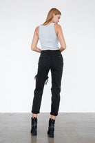 Back view of trendy black ripped jeans by Insane Gene with a fitted silhouette and stylish details