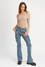 Emory Park trendy denim pants for women with a flared design and pockets, styled with an off-shoulder top