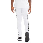 Back view of trendy leather stripe joggers in white with black leather stripes on sides