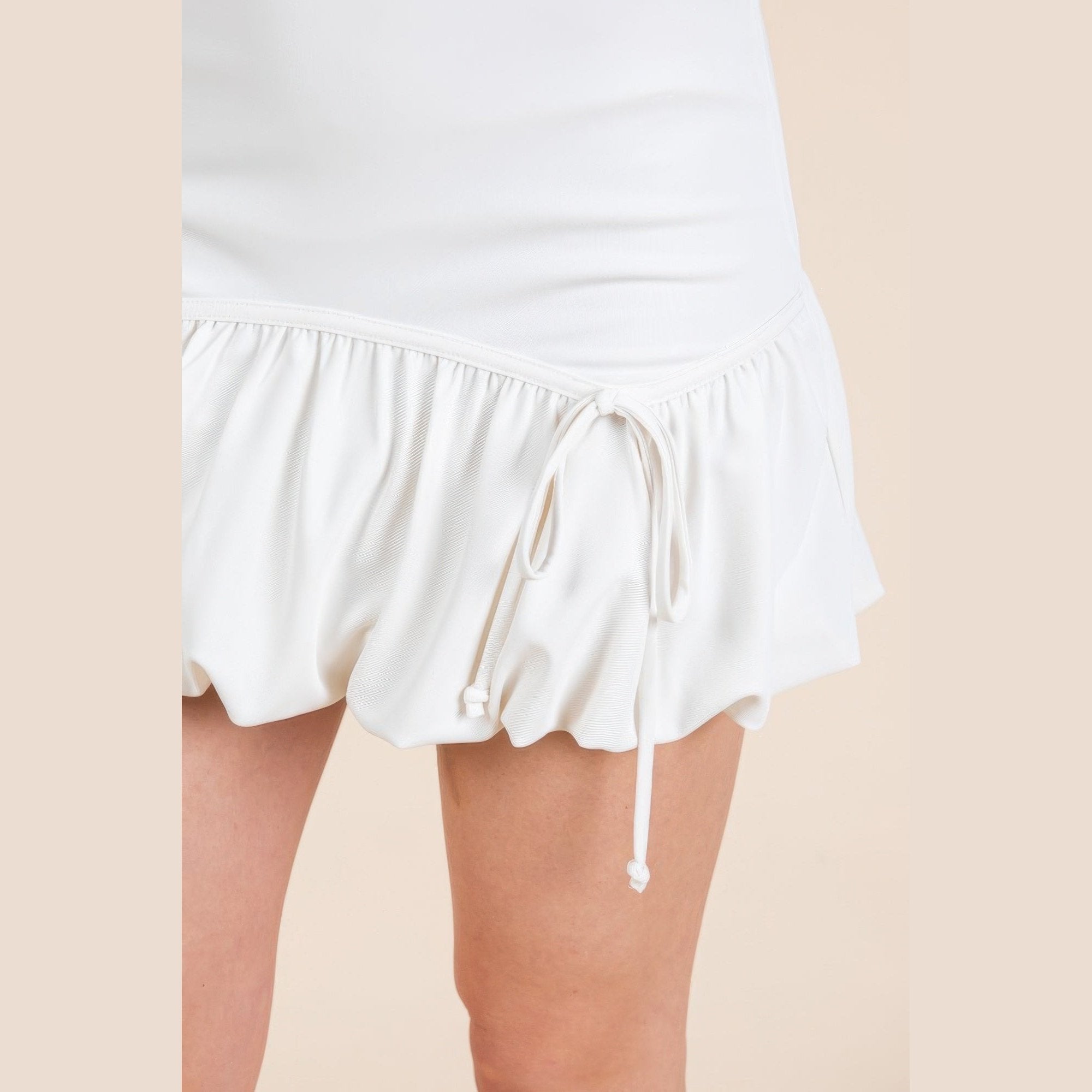 VacationGrabs white trendy summer mini skirts with ruffled hem and drawstring detail