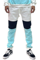 Trendy sweatpants for travel in light blue and white with a modern color-block design