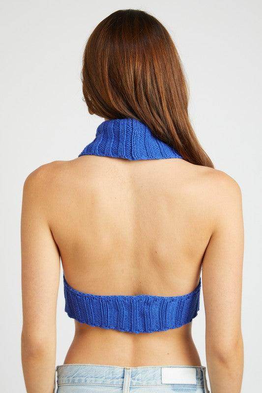 Back view of a blue trendy turtle neck sweater by Emory Park, featuring a cropped design and ribbed texture
