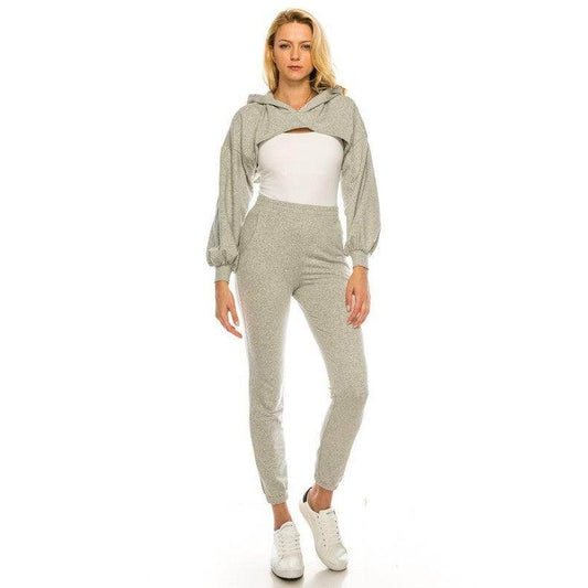Trendy two-piece outfit featuring a cropped hoodie and fitted pants in light gray for a chic casual look