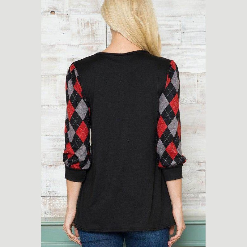 Back view of a trendy V neck top for vacations with black body and plaid sleeves