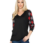 Trendy V neck top for vacations featuring black body and red argyle patterned sleeves