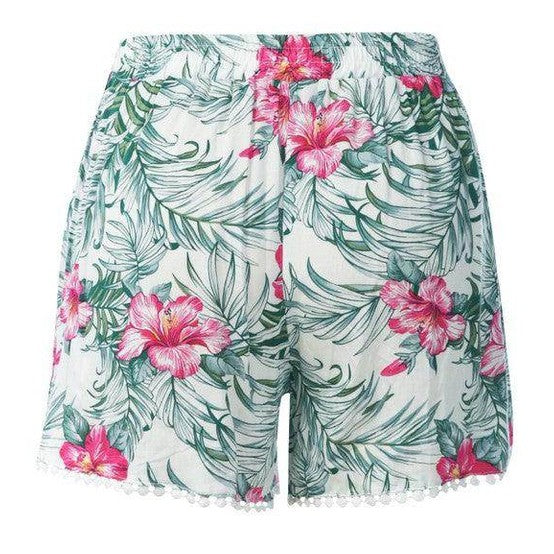 Rag Company tropical pom pom shorts featuring a floral pattern and comfortable elastic waistband