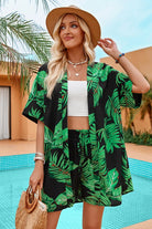 Women's tropical print dress with green palm leaves for summer gatherings