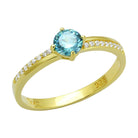 Gold 925 sterling silver ring featuring a sparkling blue gemstone and elegant diamond accents