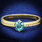 Elegant gold 925 sterling silver ring featuring a round blue stone and sparkling accent stones