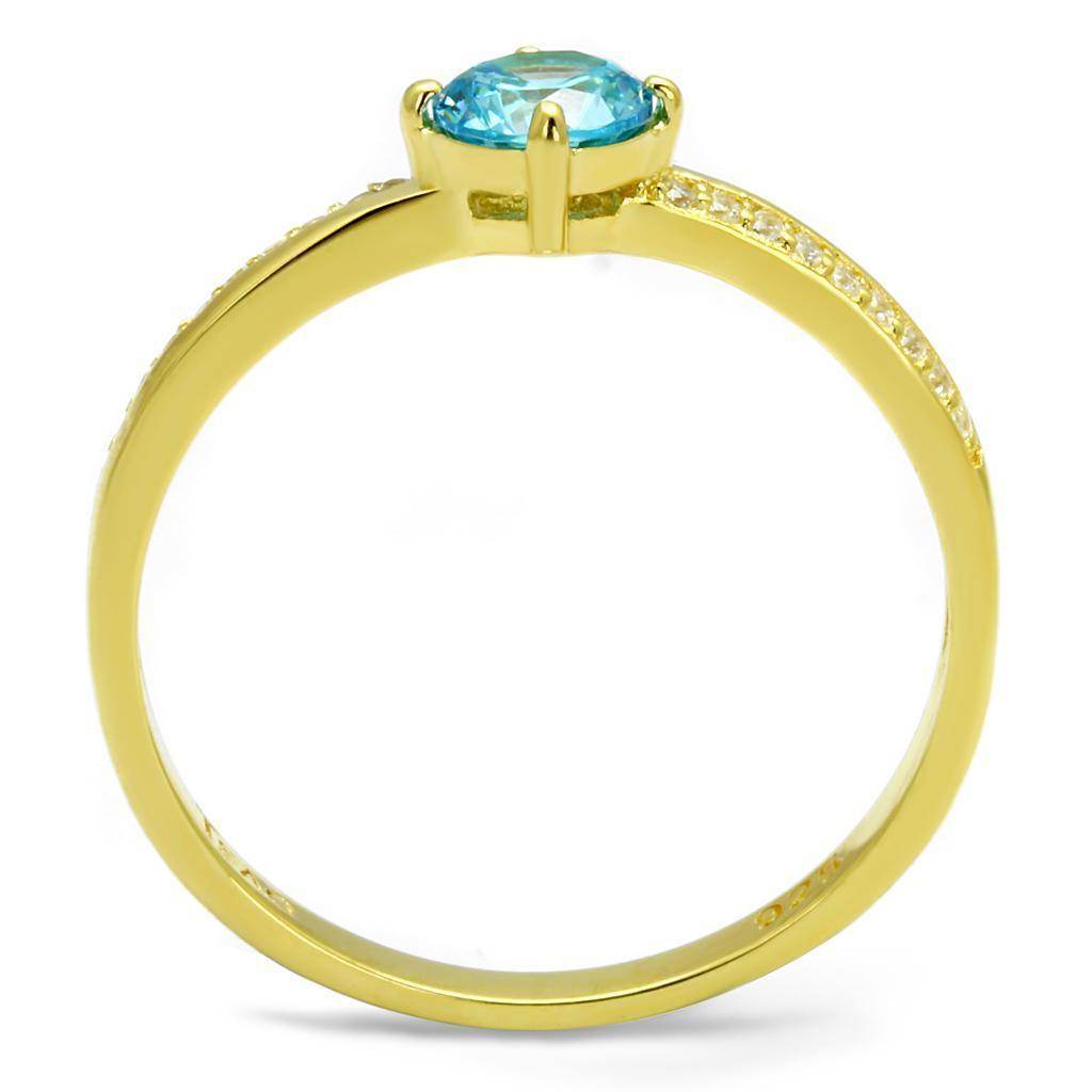 Gold 925 sterling silver ring featuring a vibrant blue gemstone and sparkling accent stones