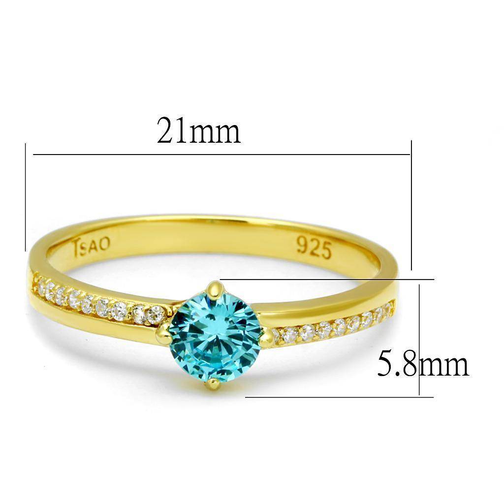 Gold 925 sterling silver ring featuring a blue gemstone and sparkling accents for elegant style