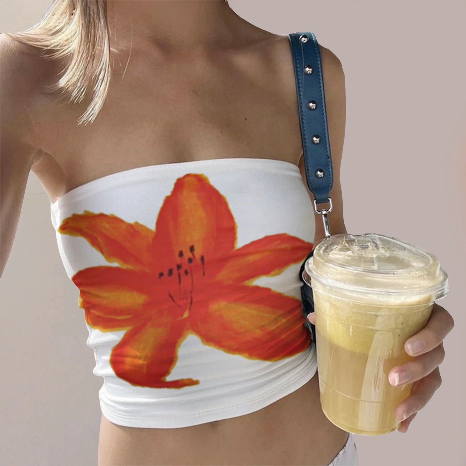 Women's white tube top with orange flower print, perfect for summer outings