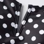 Black tummy control swimsuit with white polka dots for beach outings