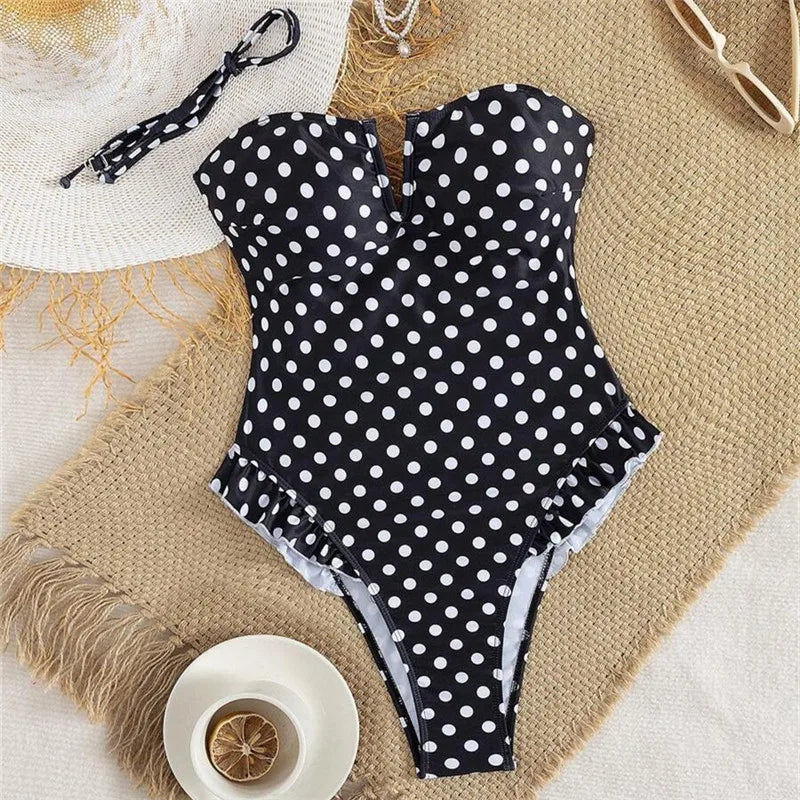 Black polka dot tummy control swimsuit for stylish beach outings