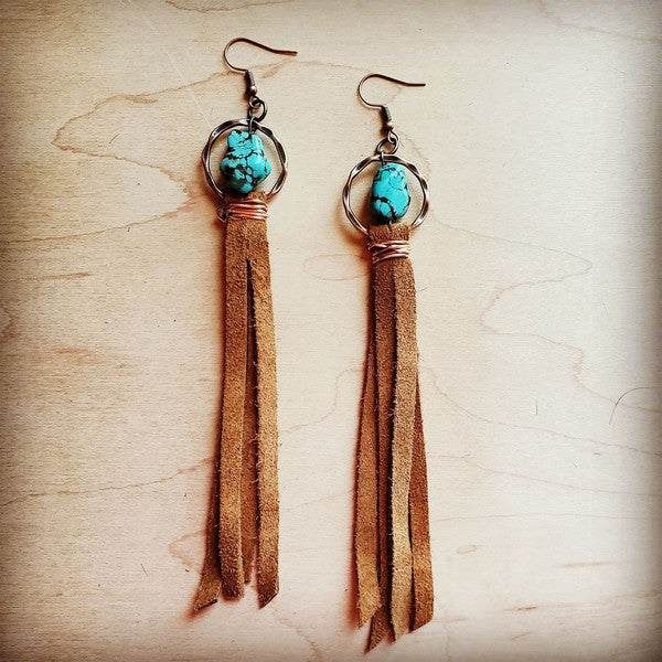 Turquoise drop earrings with suede tassel featuring a unique design and beautiful colors