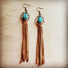 Turquoise drop earrings with suede tassel featuring a unique design and beautiful colors