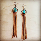 Turquoise drop earrings with suede tassel featuring a unique design and beautiful colors