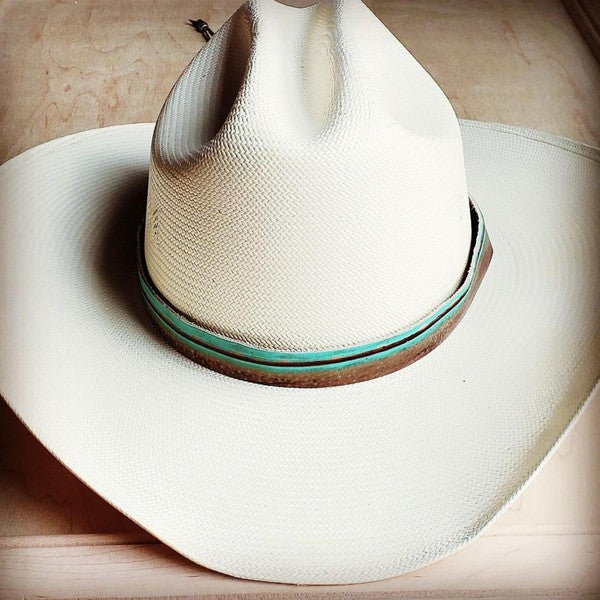 White cowboy hat featuring a turquoise Navajo leather hat band for a stylish western look