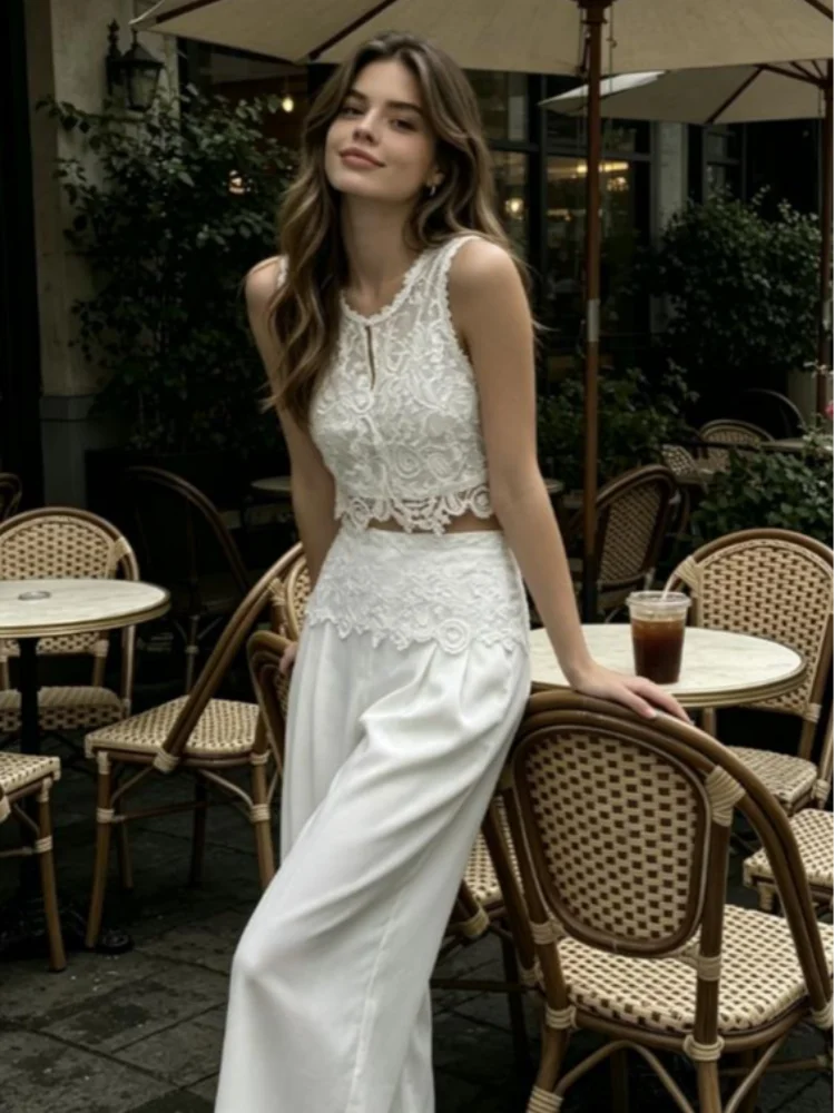 Women's white two piece set with lace top, perfect for casual outings