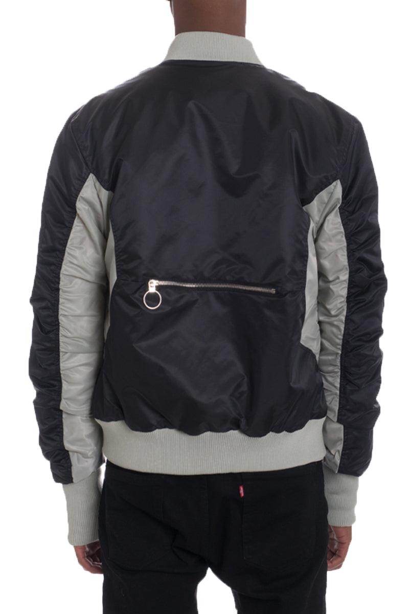 Back view of a two tone bomber for men with a zip pocket and contrasting sleeves