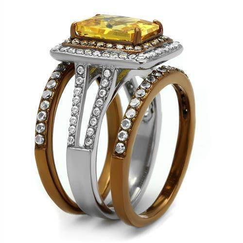 Two tone womens ring with a large yellow gemstone and sparkling accents in silver and gold tones
