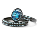 Unique black engagement ring featuring a blue oval stone surrounded by sparkling accents