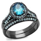 Unique black engagement ring with a vibrant blue center stone and sparkling accents on the band