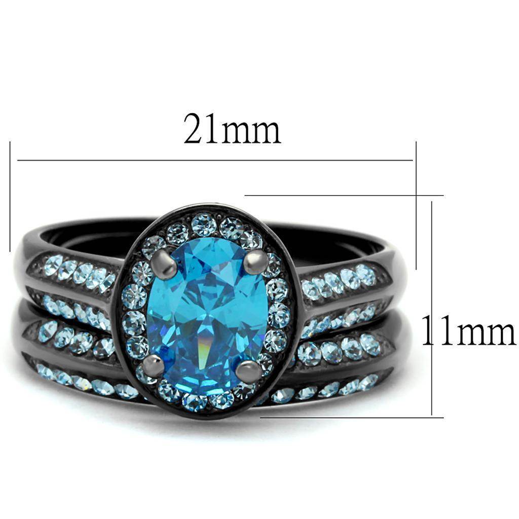 Unique black engagement ring featuring a large blue oval gemstone and sparkling accent stones