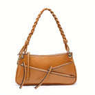 Unique handmade small shoulder bag in tan leather with a braided handle and stylish zippers