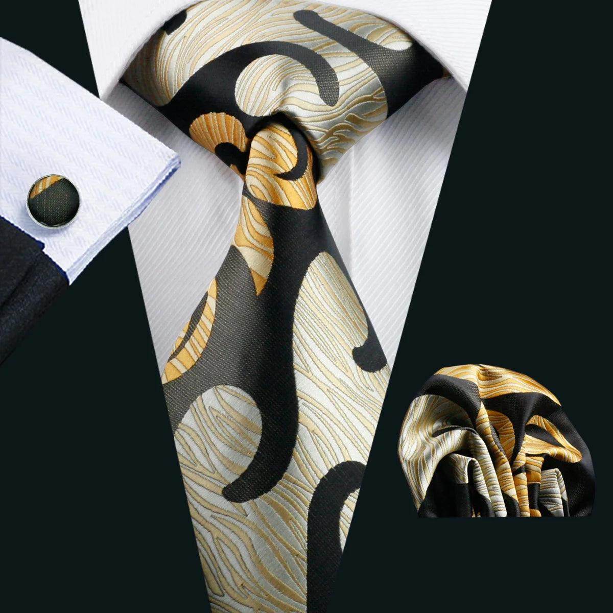 Elegant men's tie featuring unique necktie designs in black and gold patterns with matching pocket square