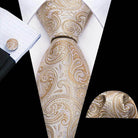 Elegant men's tie and pocket square set with unique necktie designs in gold paisley pattern